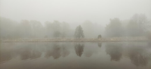 Fototapeta premium Beautiful scenic foggy river in the morning.