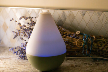 essential oil diffuser and lavender, revitalizing, calming, relaxing aroma. Wellbeing and...