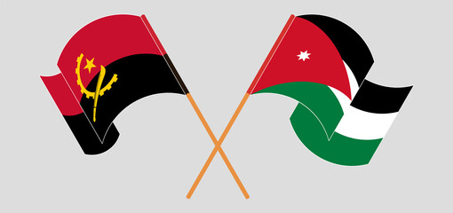 Crossed and waving flags of Angola and Jordan