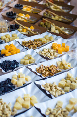 Tasting Cheese at the Fair ( olives , honey, dried apricots, raisins, walnuts, cashews )