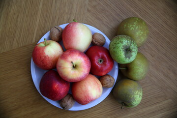Top view of red apples, rennet apples and walnuts