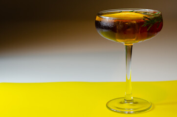 Refreshing cocktail based on gin and champagne and blood orange juice, served with a slice of...