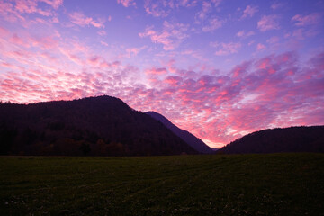 Pink sunset behind Lubnik hill in Skofja Loka