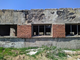 old ruined and abandoned farm outside view at daytime