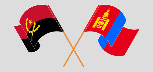 Crossed and waving flags of Angola and Mongolia