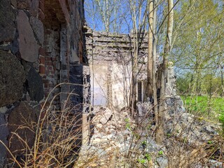 destroyed and old red brick building in the daytime inside view
