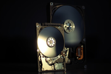 Disassembled hard drive from the computer with mirror effect. Opened hard drive from the computer...