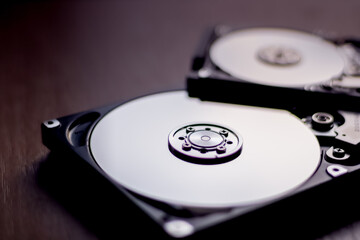 Disassembled hard drive from the computer with mirror effect. Opened hard drive from the computer...