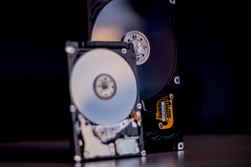 Disassembled hard drive from the computer with mirror effect. Opened hard drive from the computer...