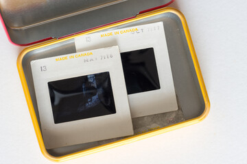 old photographic slides - made in canada - isolated in a tin box - photographed with a macro lens...