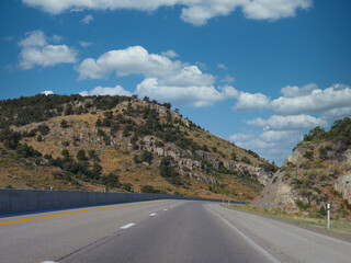Winding paved road in between hills long Highway 80 in Nevada.