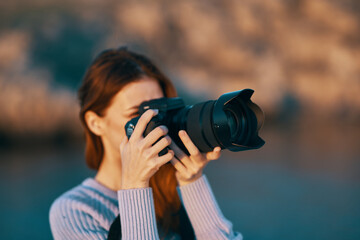 woman tourist with camera in nature Travel professional