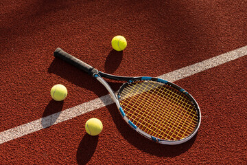 Tennis Ball with Racket on the racket in tennis court