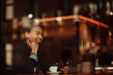 Latina woman sitting in a cafe on a break from work