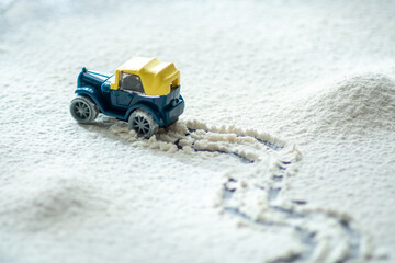 VINTAGE CAR TOY ON THE SNOW ROAD - HO SCALE