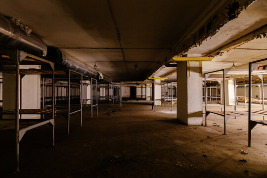 Old double-decker beds inside abandoned soviet bomb shelter