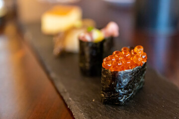 Fresh roe fish eggs sushi wrapped in seaweed © Mat Hayward