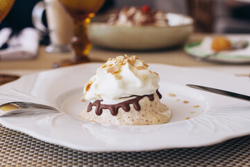 
Sweet dessert, cupcake and ice cream on white plate, on restaurant background