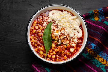 Red corn esquites on dark background. Mexican food