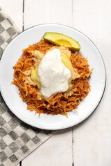Dry fideo with cheese and sour cream on white background