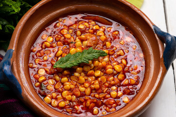 Red corn esquites on white background. Mexican food