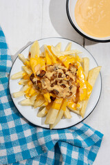 Animal style fries with cheese and caramelized onion on white background