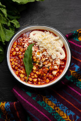 Red corn esquites on dark background. Mexican food