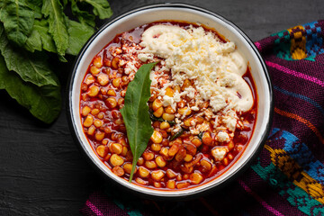 Red corn esquites on dark background. Mexican food