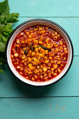 Red corn esquites on turquoise background. Mexican food