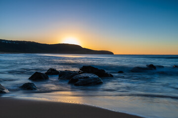 Fototapeta na wymiar Sunrise at the seaside with clear skies