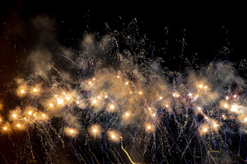 Fireworks and sparkles in a dark night sky