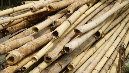 Stack of bamboo sticks. The color is brownish yellow