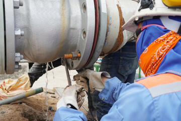 Pipeline system during installation by the construction workers in the industrial plants.