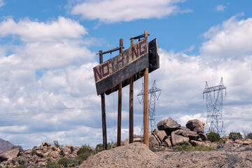 Looking like a scene from a post-apocalyptic movie, the weathered sign merely announces the zero-population non-town of Nothing, AZ.