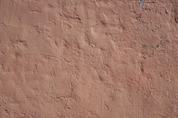 Wall texture with paste. Pink color. Background