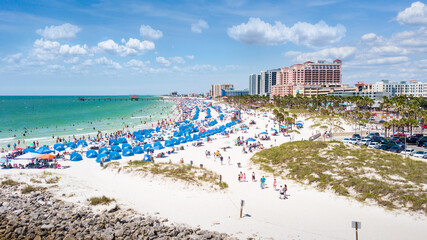 Summer vacations in Florida. Panorama of Ocean beach and Resorts in US. Blue-turquoise color of water. American Coast or shore. Island in Gulf of Mexico. Clearwater Beach FL. Aerial view on city
