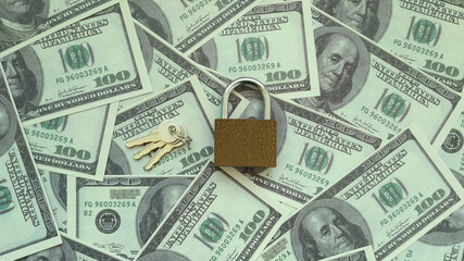 Iron lock keys on the background of American dollar bills. Housing market, sale, purchase of real estate.