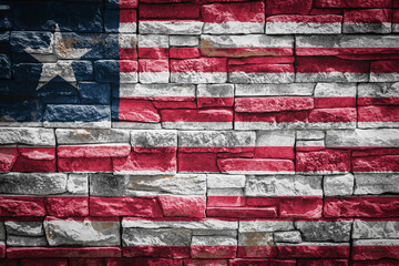 National flag of Liberia on stone  wall background.The concept of national pride and symbol of the country. Flag  banner on  stone texture background.