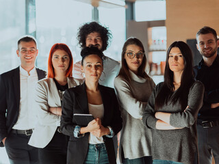Obraz premium Young Smiling Managers Standing in Modern Office. Training in Office. Modern Office Concept. Woman in White Shirt. Man in Black Suit. 