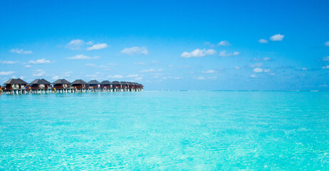 Naklejka na ściany i meble beach with water bungalows at Maldives