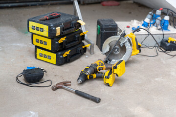 Power drill, hammer,circle saw and other equipment place on site.