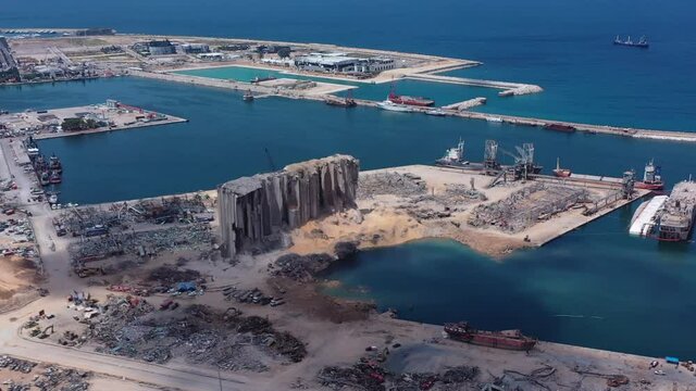 Beirut, Lebanon, 2020: day drone shot aerial view track left of the destructed port of beirut and silos due to the 4 August explosion