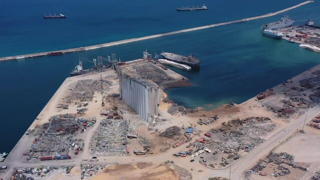 Beirut, Lebanon, 2020: day drone shot aerial view turning around the destructed port of beirut and silos due to the 4 August explosion