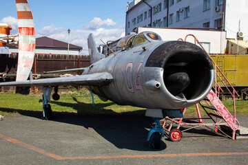 Old Soviet jet fighters are at the airfield. Aviation museum with old jet planes