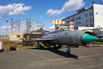 Old Soviet jet fighters are at the airfield. Aviation museum with old jet planes
