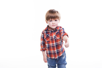 Little boy in plaid shirt thumb up isolated