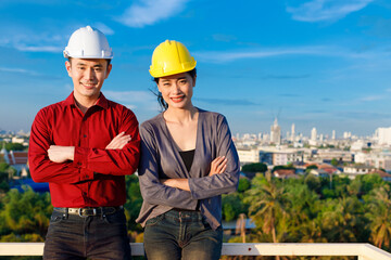 Positive Asian contractors looking at camera