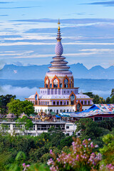 Naklejka premium Beautiful pagoda of Tha Ton Temple set amid green mountains in Chiang Mai,Thailand.