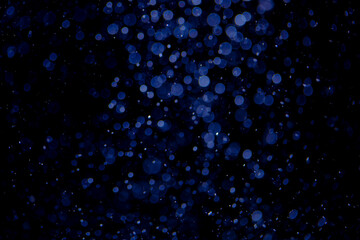 Glittering stars of blue bokeh