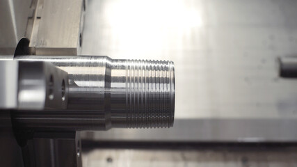 Turning lathe in action. Facing operation of metal blank on turning machine with cutting tool. Old turning lathe machine in turning workshop. Machining high precision mold part by cnc